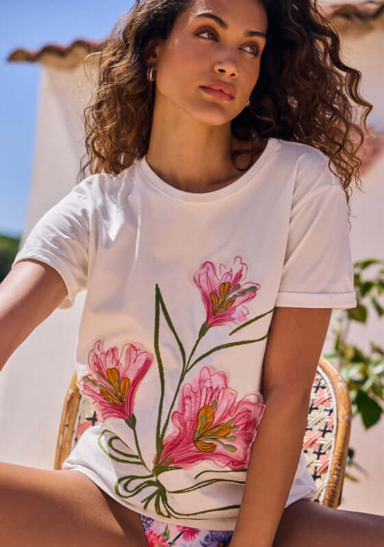 Gea Chroma T Shirt by Agua Bendita, featuring elegant floral embroidery on a stylish white t-shirt, perfect for casual wear.