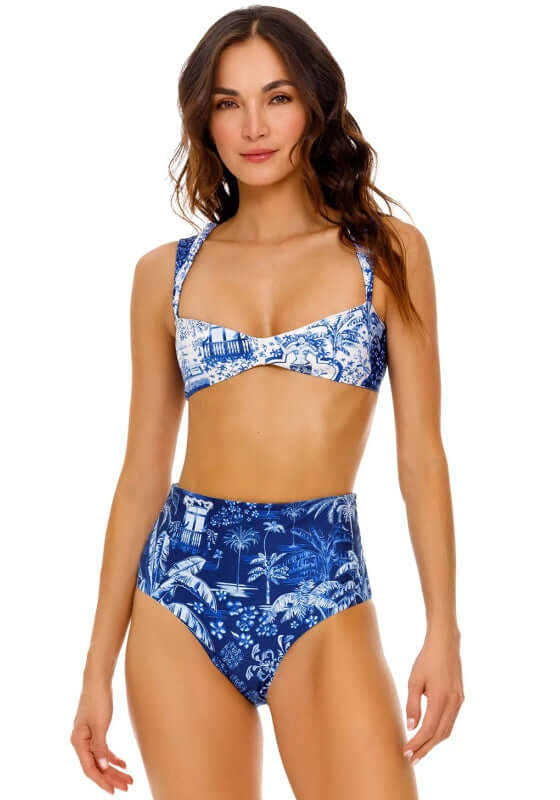 Malory High Waisted Tales Bikini by Agua Bendita. Model wearing a blue print bikini with high waist and removable pads.