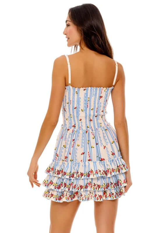 Alamy Dress Citrus by Agua Bendita, back view of a playful tiered summer dress with floral placement print.