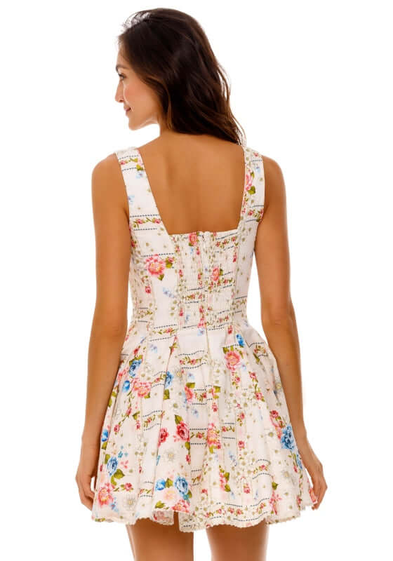 Kristen Dress Meraki by Agua Bendita, showcasing the back design with floral patterns and a fitted bodice.
