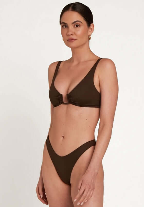 Palma Bikini Espresso by Away That Day model showcasing chic U bar detail and flattering design in brown swimwear.