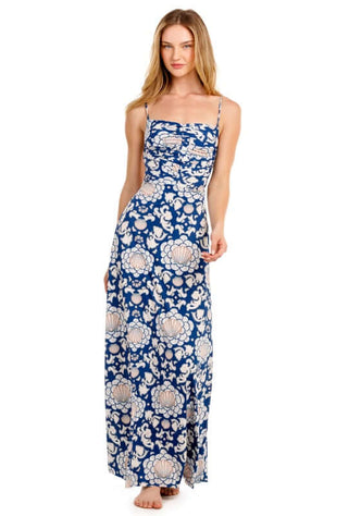 Arista Sereia Dress by Agua Bendita model wearing a floral maxi dress showcasing adjustable straps and open back.