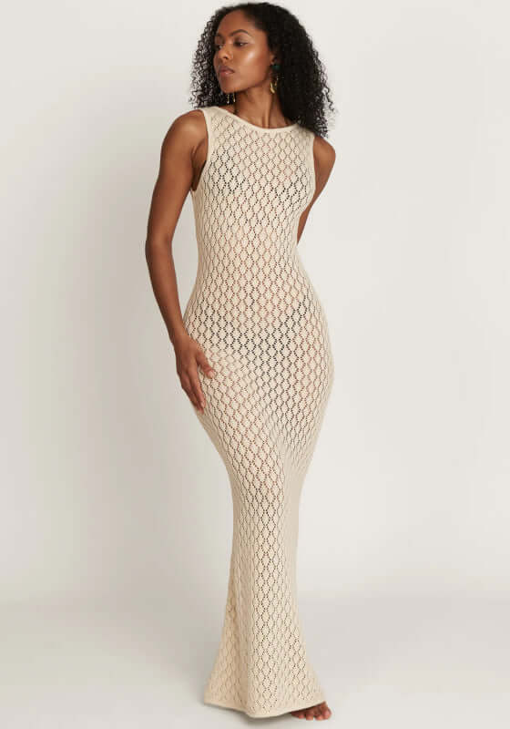 Model wearing the Abaco Dress Ivory by Away That Day, featuring a figure-hugging design and chic tortoise shell buckle.