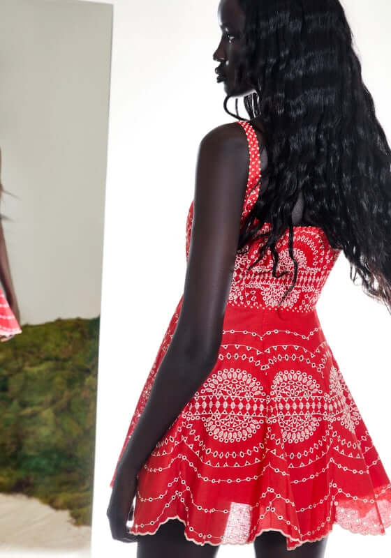 Winnie Dress Red Nelum by Charo Ruiz, showcasing a skater silhouette and embroidered detail in a vibrant red.