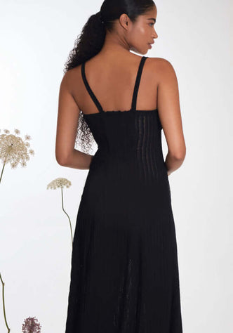Devi Maxi Dress Black by Charo Ruiz, showcasing the back view with delicate straps and flattering fit.