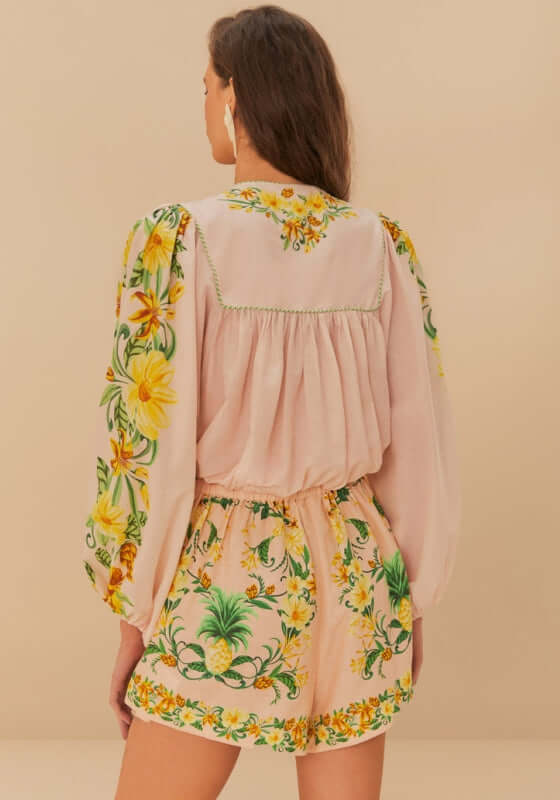 Pink Botanical Beauty Shorts by Farm Rio, featuring vibrant botanical prints and playful tie detail on a model.