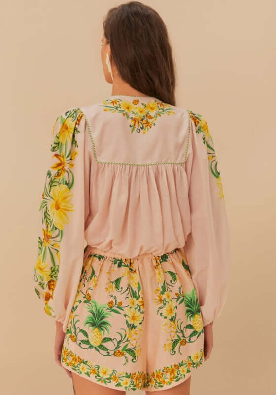 Pink Botanical Beauty Long Sleeve Blouse by Farm Rio, showcasing floral patterns and delicate green trims on a model.