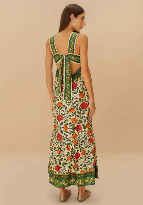 Sand Garden Tapestry Maxi Dress by Farm Rio, showcasing the elegant back with a playful bow and vibrant floral patterns.