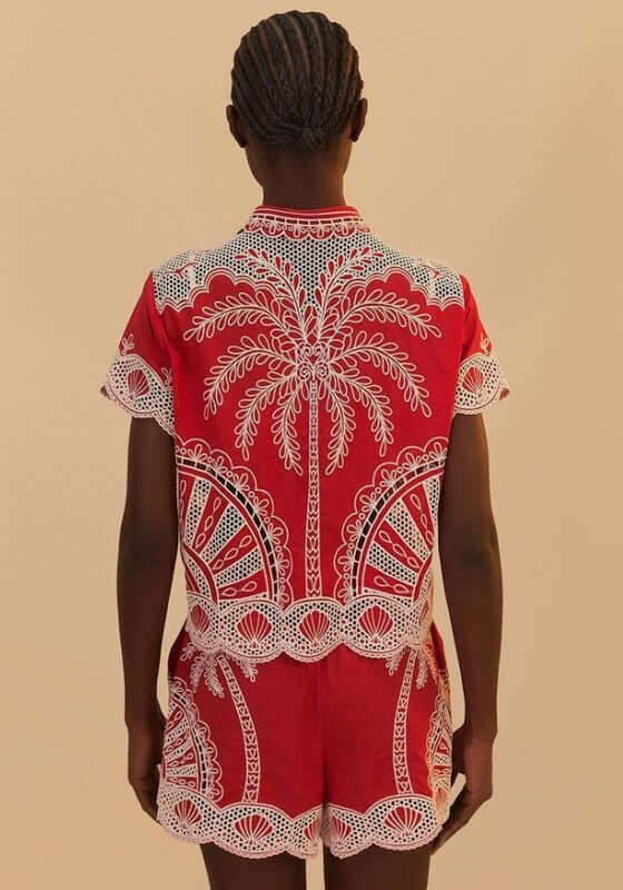Red Palm Tree Shorts by Farm Rio, featuring a back view with white embroidered palm tree pattern on vibrant red fabric.