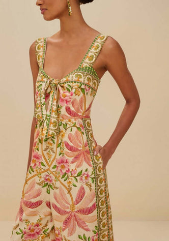 Palm Dream Jumpsuit by Farm Rio, showcasing floral patterns, sweetheart neckline, and practical side pockets.