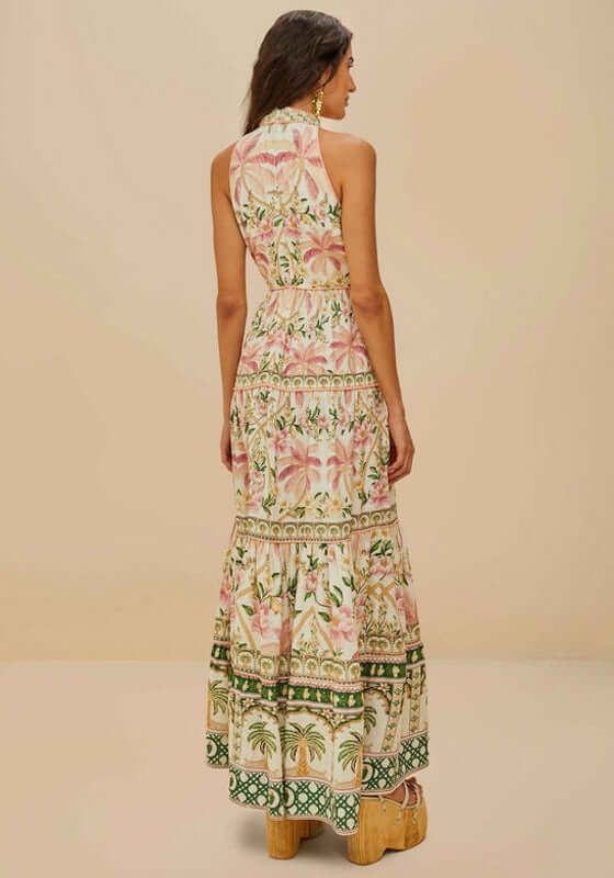 Palm Dream Maxi Dress by Farm Rio, showing the back view with lush palm and floral patterns in soft pastel colors.