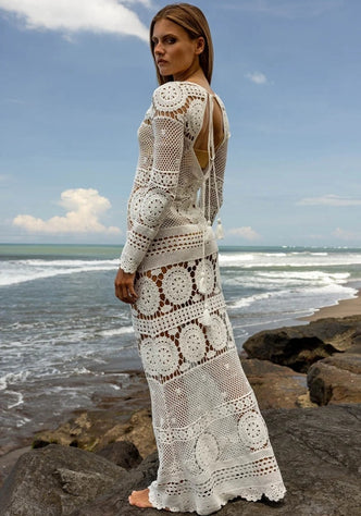 Birkin Dress Miss June by Miss June, a cotton crochet maxi dress showcasing a flirty boho style by the beach.