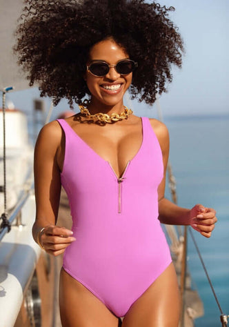 Malibu Zip Up Swimsuit Purple Orchid by Naia Beach, featuring a V-neck and zip-front for a chic beach look.