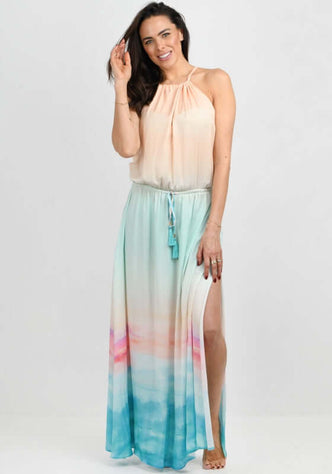 Pelosa Dress Ocean by Naia Beach, featuring a flowing maxi dress with a serene ocean-inspired print and adjustable drawstring waist.