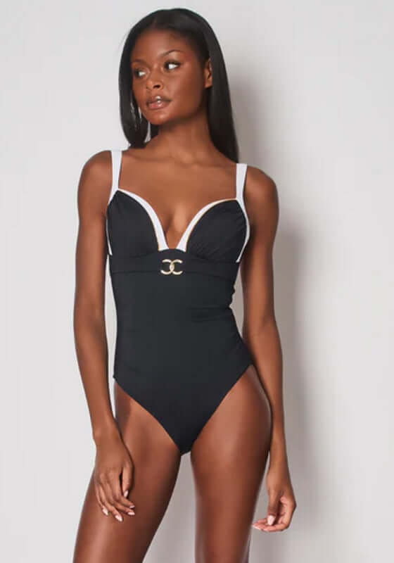 Riviera Moulded Swimsuit by Naia Beach, featuring structured cups and adjustable straps, modeled by a woman with long hair.