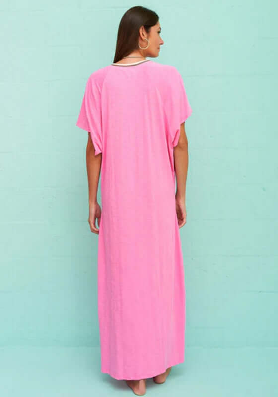 Pima Abaya Kaftan Bubblegum by Pitusa, featuring a model wearing a vibrant pink kaftan from the back.