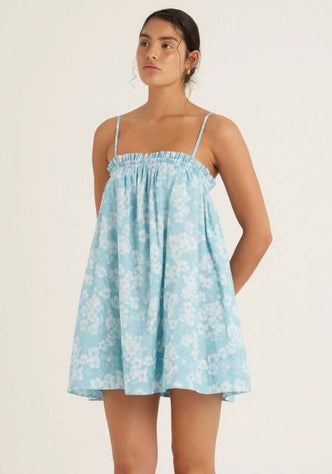 Ruched Mini Dress Paper Daisy by Peony, featuring a chic blue and white floral pattern and delicate thin straps for summer style.