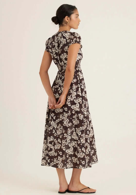Vacation Midi Dress Florentine by Peony, featuring a romantic brown floral pattern and puff shoulders.