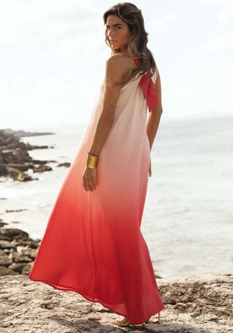 Santorini Dress Sunset Ombre Red by Sole Lisboa, featuring a flowy red ombre maxi dress by the beach.