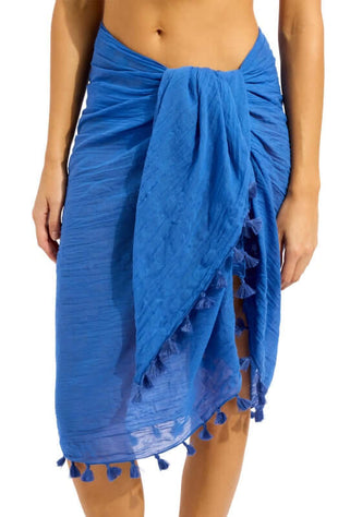 Cotton Gauze Sarong Sapphire by Seafolly worn by a model, featuring a vibrant sapphire hue and playful tassel trim.