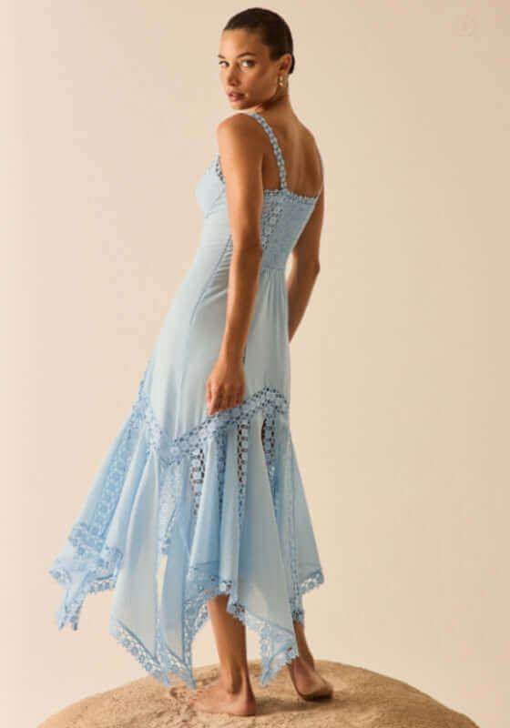 Blossel Long Dress Blue Artic by Charo Ruiz, elegant light blue maxi dress with lace detailing and a flowy design.