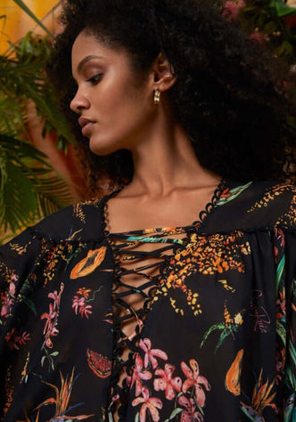 Ivet Kaftan Black Fresca by Charo Ruiz, featuring a lace-up V neck and vibrant floral print.