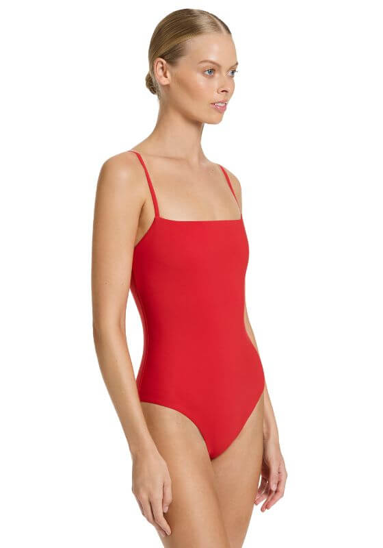 Jetset Tank Swimsuit Rosso by Jets, red swimsuit with square scoop neckline and adjustable straps on a model.