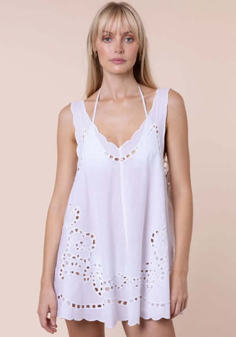 Cutwork Low Back Dress White by Juliet Dunn, showcasing a lightweight, scalloped trim, sleeveless mini beach dress for summer.