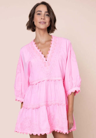 Poplin Tiered Mini Dress Flamingo by Juliet Dunn, featuring a V-neckline, scalloped hem, and puffy long sleeves.