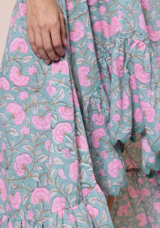 Gingko High-Lo Dress Cactus by Juliet Dunn, showcasing a detailed floral design in pink and turquoise fabric.