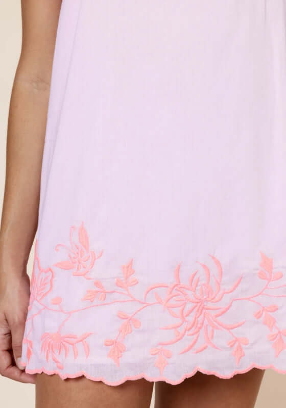 Butterfly Tie Strap Mini Dress Petal Pink by Juliet Dunn showcasing intricate pink embroidery on the hem.
