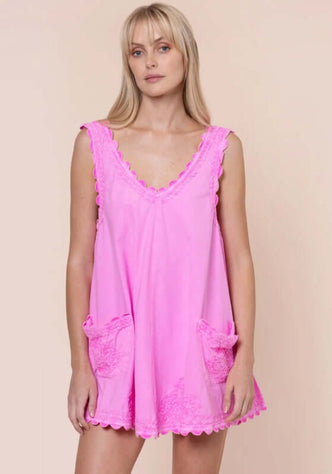 Poplin Low Back Dress Hibiscus by Juliet Dunn, featuring a pink sleeveless design with playful patch pockets.