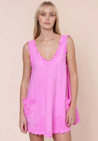 Poplin Low Back Dress Hibiscus by Juliet Dunn, featuring a pink low back dress with playful patch pockets.