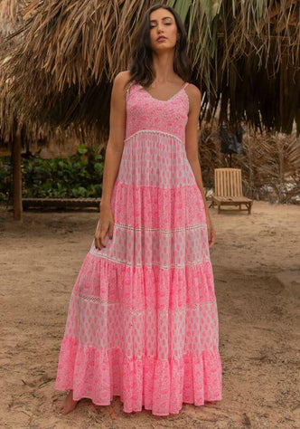 Davana Dress by Miss June, a vibrant neon pink tiered maxi dress with spaghetti straps and lace trim.