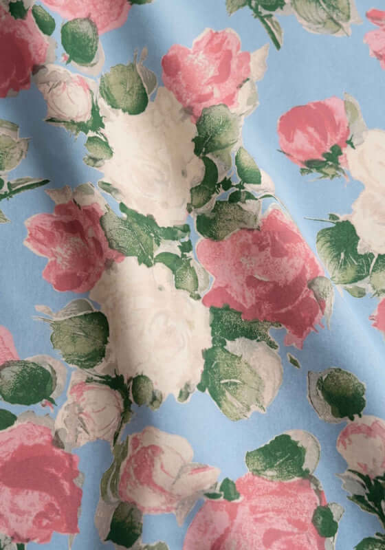 Enamour Sarong by Peony, floral print fabric featuring pink, blue, and green hues, perfect for beachwear.