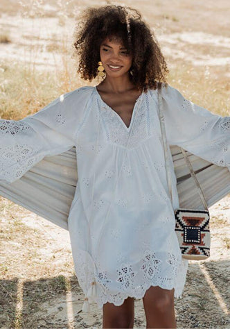Santorini Dress White by Piti Cuiti, breezy white embroidered dress with flare sleeves and V-neckline.