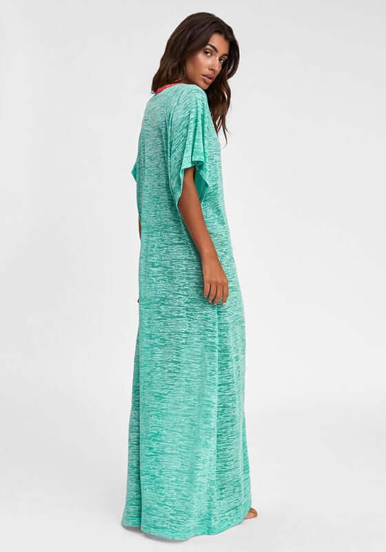 Inca Abaya Kaftan Mint by Pitusa featuring a model in a mint green kaftan with a deep v neckline and embroidered trim.