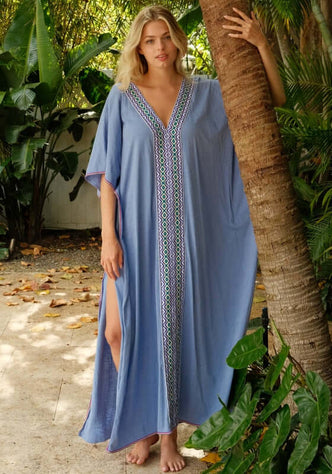 Monochromatic Thobe Periwinkle by Pitusa featuring a deep V-neckline, flutter sleeves, and Inca trim.