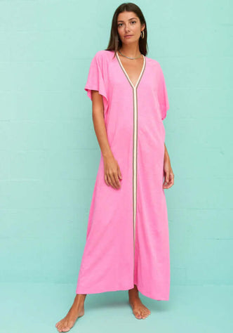 Pima Abaya Kaftan Bubblegum by Pitusa, showing a model in a deep v neckline pink kaftan with contrast embroidery.