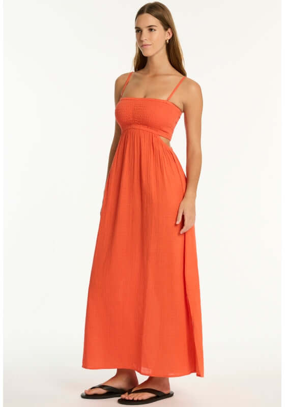 Sunset Bandeau Dress Flame by Sea Level, a model wearing a red flame beach dress with a shirred bust.