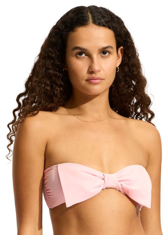 Beau Bow Front Bandeau Bikini Top by Seafolly, featuring a model wearing a stylish pink bandeau bikini top.