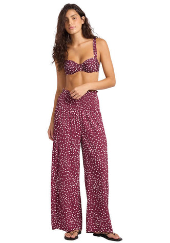 Dolce Dot Shirred Waist Beach Trouser by Seafolly, model wearing burgundy trousers with white polka dots, beach attire.
