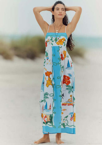 Viva Vacation Maxi Dress by Seafolly, a model wearing a floral print maxi dress on the beach, ideal for summer getaways.