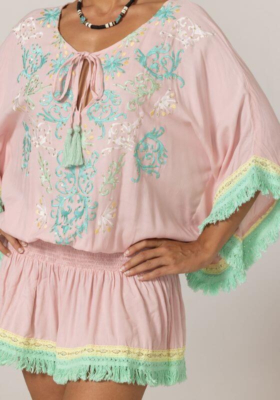 Sejla Kaftan Pink by Miss June featuring an embroidered v neckline with lace up detail and fringe hem.