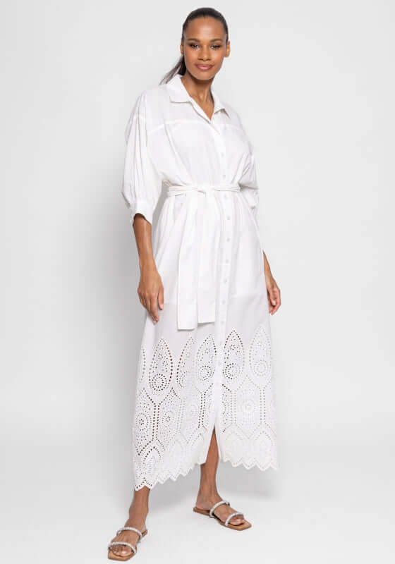 FloFlo White Dress by Sundress, model in a white maxi shirtdress with delicate eyelet patterns and a buttonhole.