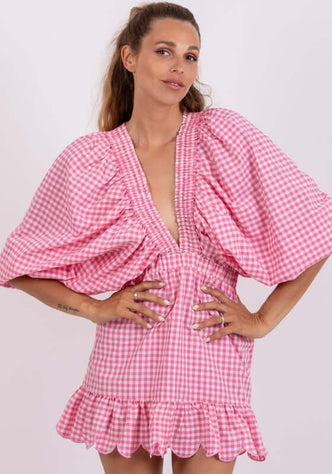 Marine Short Dress by Sundress, model wearing pink gingham dress with kimono sleeves and scalloped hem.
