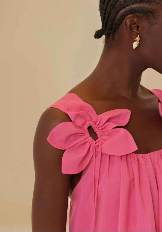 Pink Floral Midi Dress by Farm Rio featuring a close-up of flower straps on a pink sleeveless dress.