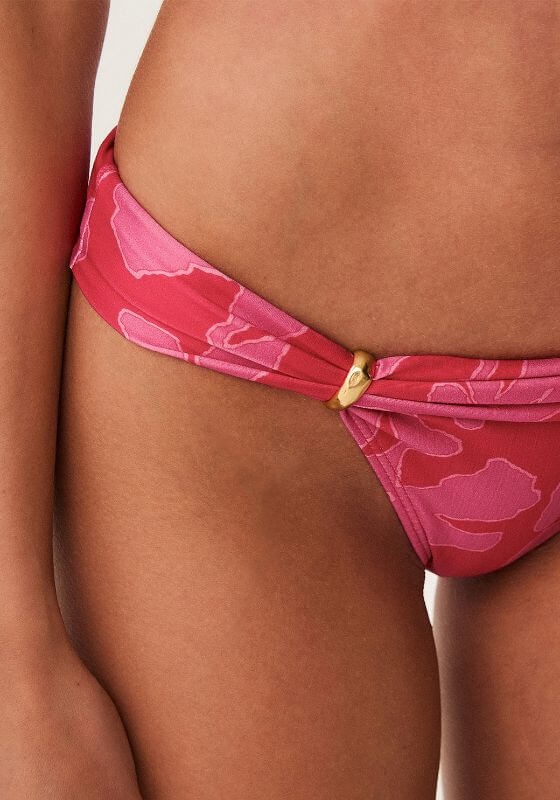 Florima Bia Bikini Bottoms by Vix Swimwear, featuring a close-up detail of the pink floral design and gold accent.