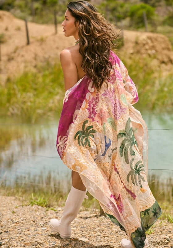 Atzi Tunic Thamar by Agua Bendita, lightweight mesh cover-up with tropical design worn by a woman at the beach.