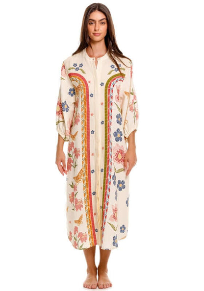 Clavelina Fiore Beach Tunic by Agua Bendita, model wearing the tunic with floral print on a light background.